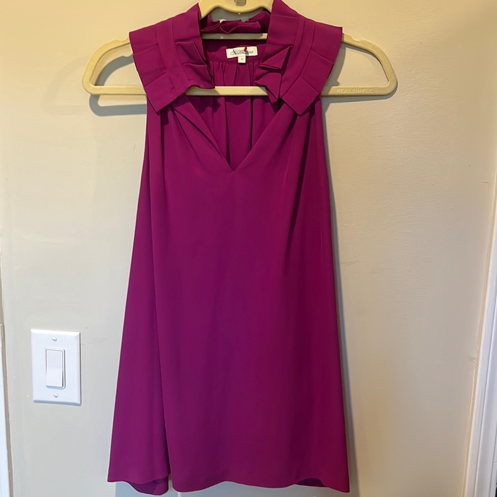 Magenta loose fitting /flowy sleeveless top.